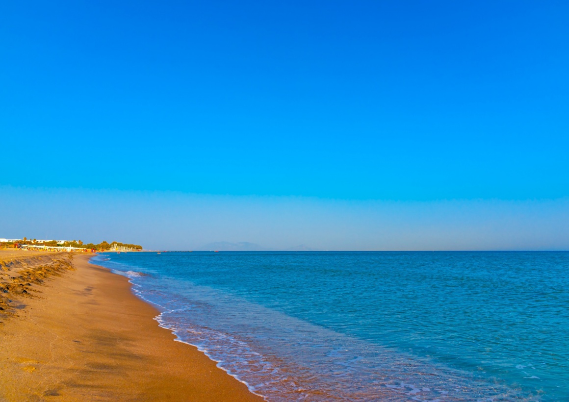 'the beautiful long sandy beach at Chelona cape near Kardamaina village at Kos island in Greece' - Κως