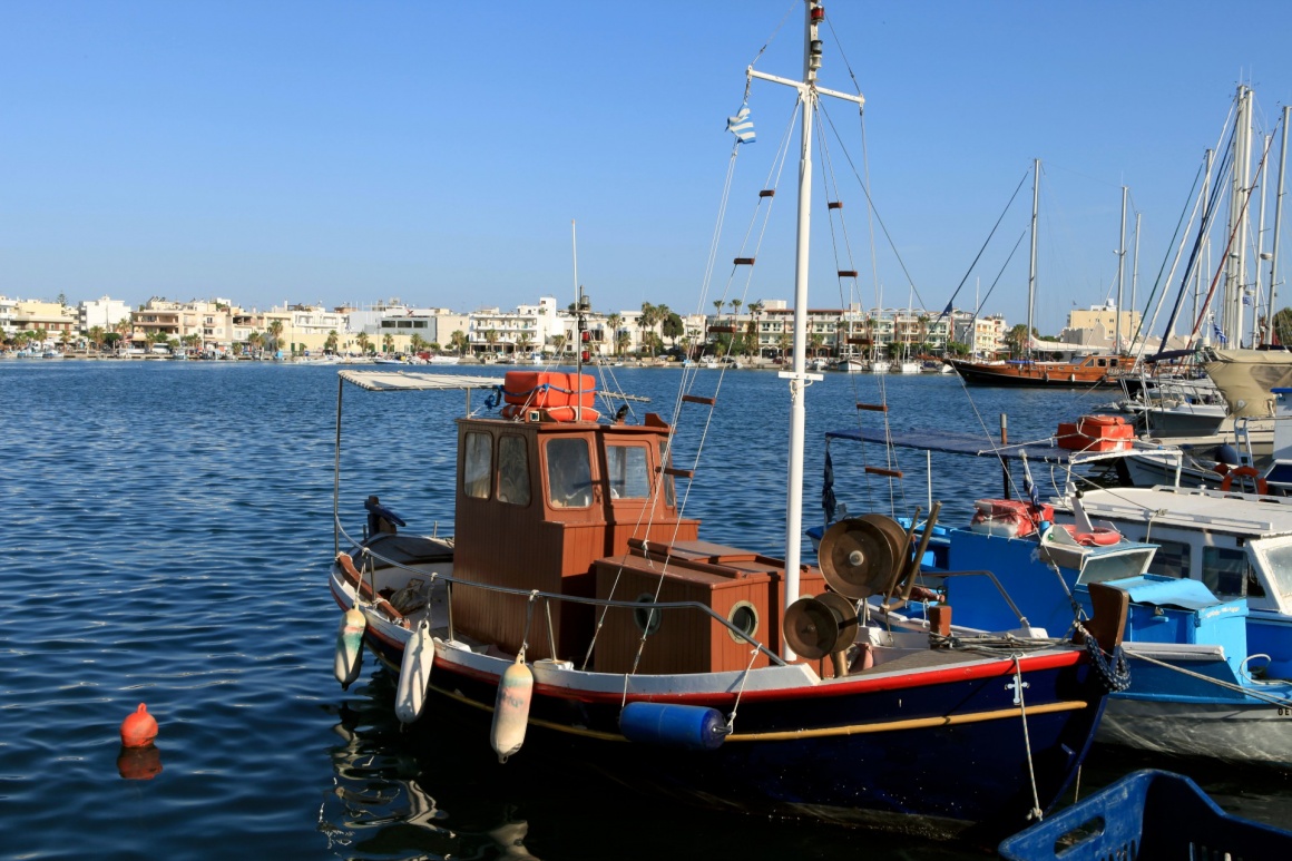 'Wooden fishing boat in the port' - Κως